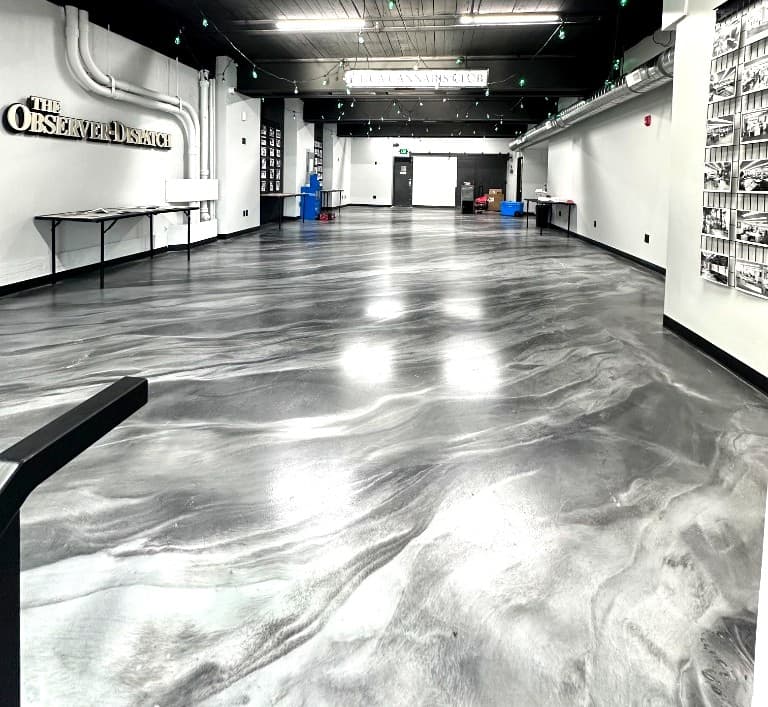 Gray pearl metallic floor in a large Utica commercial space — Nick's Concrete Coating, Central New York