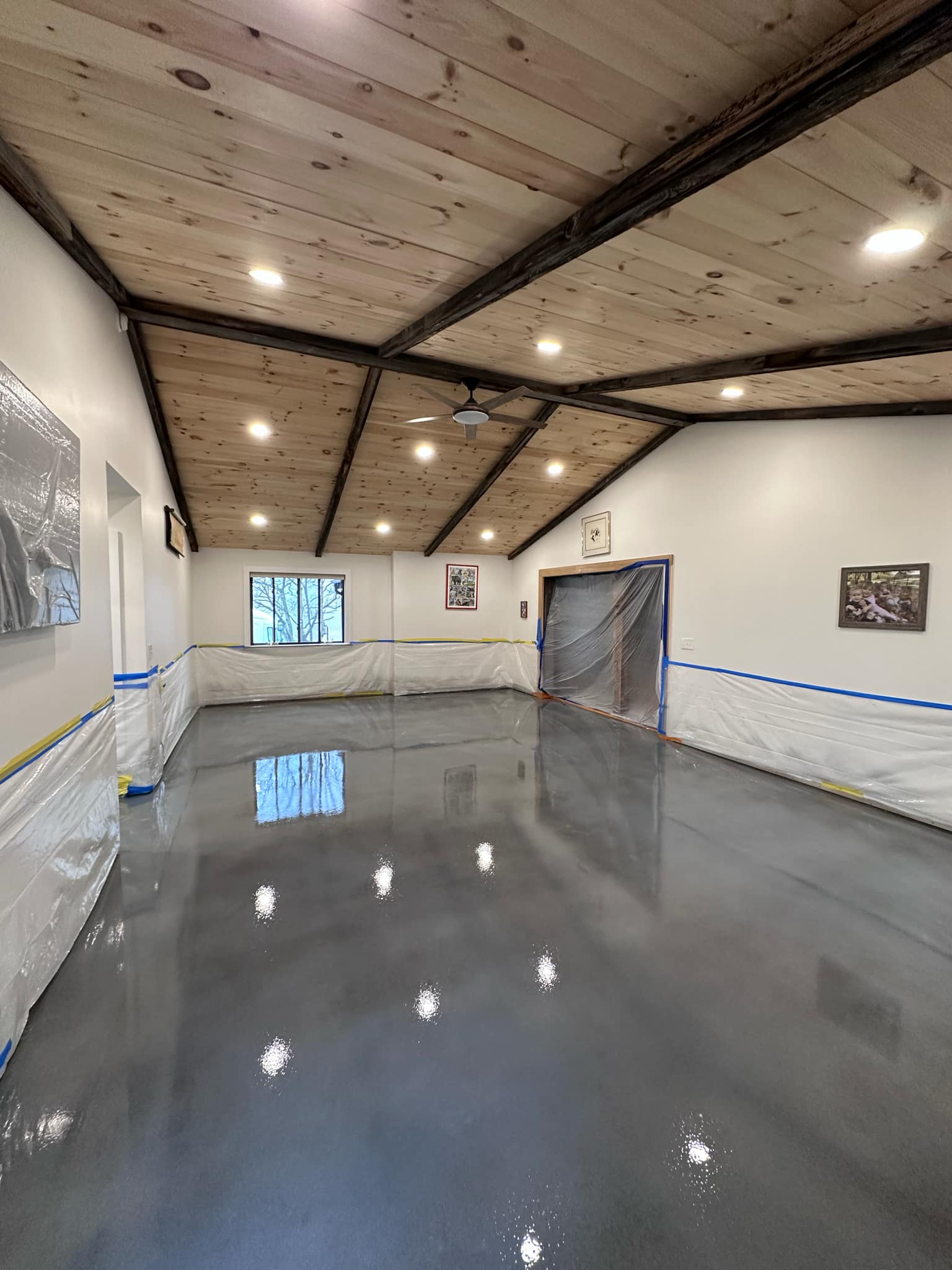 Glossy solid gray metallic floor in a large space — Central New York